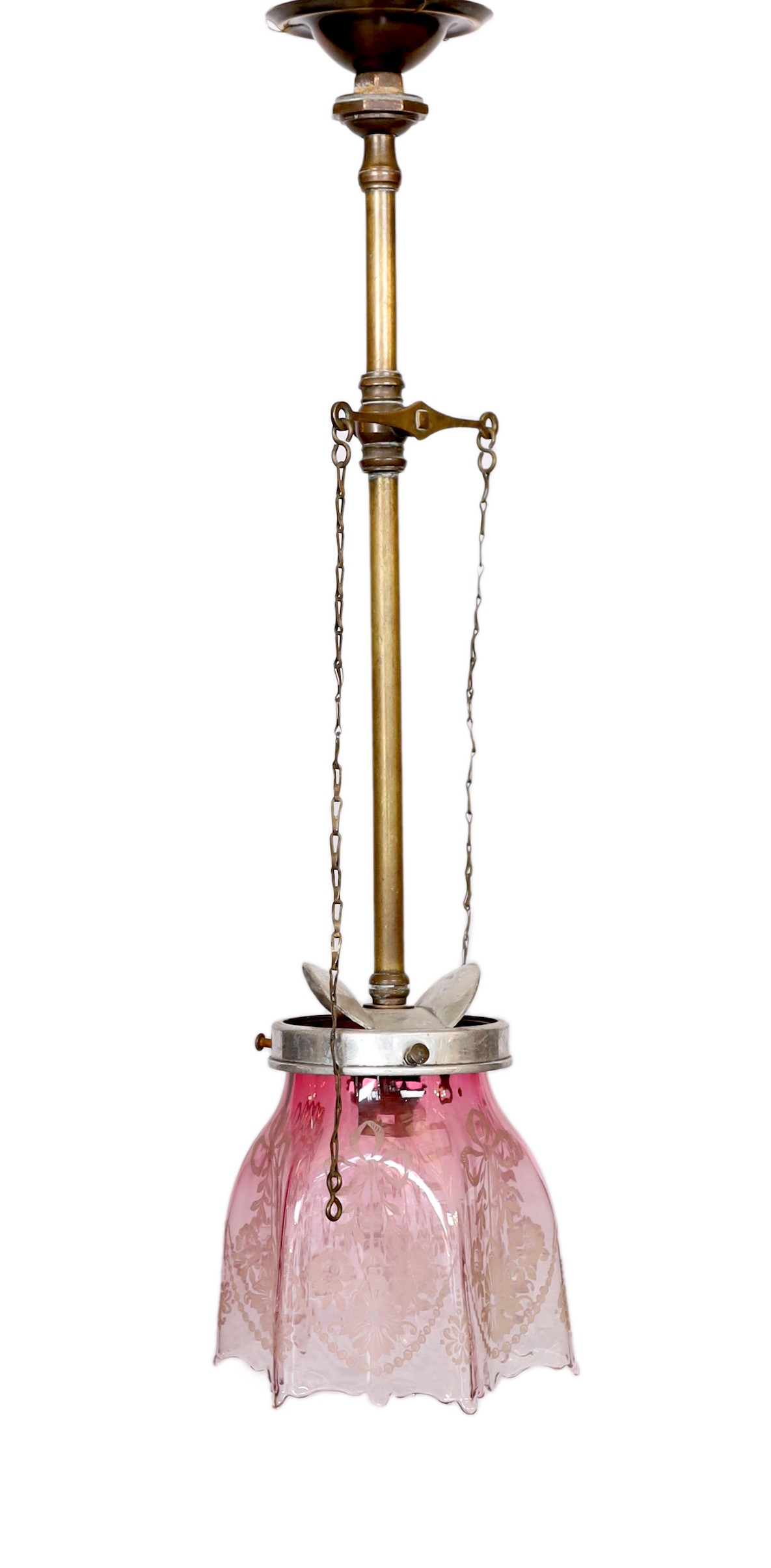 An early 20th century English brass gasolier light fitting, converted to electricity, with pink tinted etched glass shade, height 50cm